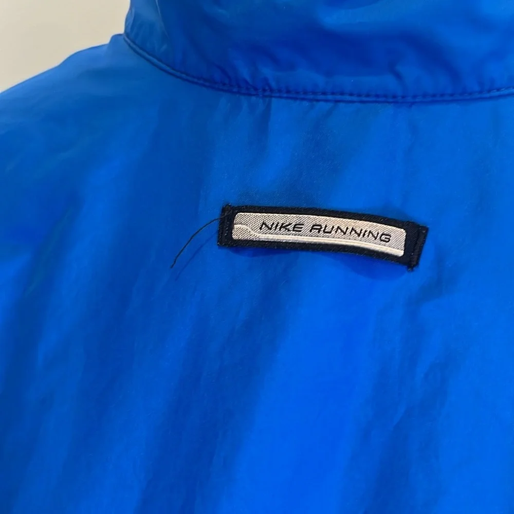 Nike youth L royal blue grey 1/2 zip windbreaker. Loose fit. Great condition